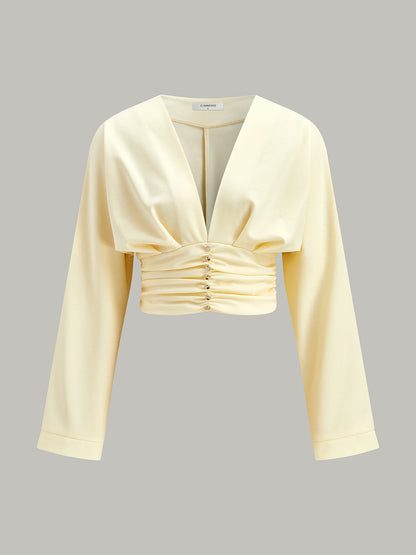 V Yaka Kıvrımlı Bel Dekor Düğmeli Kırpılmış Bluz